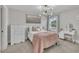 Bedroom with chandelier, large window, vanity and closet at 243 E Wellesley Dr, Clayton, NC 27520