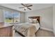 Serene bedroom with a dark wood bed, neutral decor, and soft natural lighting at 243 E Wellesley Dr, Clayton, NC 27520