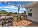 Relaxing wooden deck with a grill, space heater, and a view of the expansive backyard at 243 E Wellesley Dr, Clayton, NC 27520