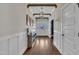 Bright foyer with hardwood floors, decorative lighting, and paneled walls at 243 E Wellesley Dr, Clayton, NC 27520
