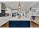 Gourmet kitchen featuring a large island, stainless steel appliances, and pendant lighting at 243 E Wellesley Dr, Clayton, NC 27520