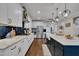 Gourmet kitchen featuring a large island, stainless steel appliances, and pendant lighting at 243 E Wellesley Dr, Clayton, NC 27520