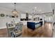 Gourmet kitchen featuring a large island, stainless steel appliances, and pendant lighting at 243 E Wellesley Dr, Clayton, NC 27520