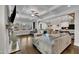 Open-concept living room with coffered ceilings, hardwood floors and spacious seating at 243 E Wellesley Dr, Clayton, NC 27520