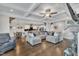 Open-concept living room with coffered ceilings, hardwood floors and fireplace at 243 E Wellesley Dr, Clayton, NC 27520