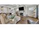 Living room featuring hardwood floors, fireplace, and coffered ceiling at 243 E Wellesley Dr, Clayton, NC 27520