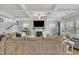 Spacious living room featuring coffered ceilings, fireplace, and abundant natural light at 243 E Wellesley Dr, Clayton, NC 27520