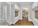 Spacious mudroom features custom built-ins, bench seating and pantry at 243 E Wellesley Dr, Clayton, NC 27520