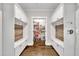 Mudroom has custom cabinetry, bench seating, coat hooks and pantry at 243 E Wellesley Dr, Clayton, NC 27520