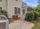 Backyard patio with outdoor seating near the house and greenery at 244 Elmcrest Dr, Holly Springs, NC 27540