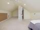Finished upper-level bonus room featuring neutral carpet and ceiling fan at 244 Elmcrest Dr, Holly Springs, NC 27540
