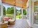 Inviting front porch with comfortable seating, showcasing a serene outdoor living space at 244 Elmcrest Dr, Holly Springs, NC 27540