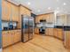 Well-equipped kitchen with stainless steel appliances, granite countertops, and ample cabinet space at 244 Elmcrest Dr, Holly Springs, NC 27540