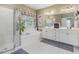 Spacious main bathroom with a shower, soaking tub, and double vanity at 244 Elmcrest Dr, Holly Springs, NC 27540