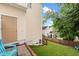 A home backyard with a door, manicured lawn, and fenced perimeter with stairway at 2445 Sapphire Valley Dr, Raleigh, NC 27604