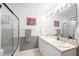 Bathroom with double sink vanity, framed mirror and bath shower at 2445 Sapphire Valley Dr, Raleigh, NC 27604