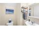 Well-lit powder room features modern fixtures and tasteful decor, creating a comfortable experience at 2445 Sapphire Valley Dr, Raleigh, NC 27604