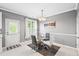 Chic dining area with a glass table, modern chairs, and plenty of natural light for pleasant meals at 2445 Sapphire Valley Dr, Raleigh, NC 27604