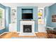Living room with a cozy fireplace flanked by built-in shelving, creating a focal point for gathering at 2445 Sapphire Valley Dr, Raleigh, NC 27604