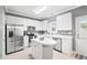 Bright kitchen with stainless steel appliances, center island, and ample cabinet space offering form and function at 2445 Sapphire Valley Dr, Raleigh, NC 27604