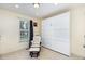 A bedroom featuring a Murphy bed system and a comfortable chair and ottoman at 281 Kinsman Ct, Fuquay Varina, NC 27526