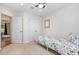 This is a bedroom with a ceiling fan, carpet, closet, window and door at 281 Kinsman Ct, Fuquay Varina, NC 27526