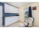 Office space features a storage, chair and ottoman by window with a printer, desk, and picture at 281 Kinsman Ct, Fuquay Varina, NC 27526