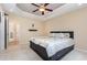 Cozy bedroom with ceiling fan, neutral tones, and access to an en-suite bathroom at 281 Kinsman Ct, Fuquay Varina, NC 27526