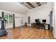 Bonus Room showcasing wood floor, desk, office chair, treadmill and lots of natural light at 281 Kinsman Ct, Fuquay Varina, NC 27526