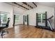 Bonus Room featuring a treadmill, wood floor, office chair, desk and multiple windows at 281 Kinsman Ct, Fuquay Varina, NC 27526