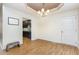 Dining room features tray ceiling and chandelier, with convenient access to the kitchen at 281 Kinsman Ct, Fuquay Varina, NC 27526