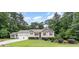Charming two-story home featuring a well-manicured lawn, an attached two car garage and mature landscaping at 281 Kinsman Ct, Fuquay Varina, NC 27526