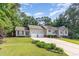Beautiful home with a well-maintained lawn, two-car garage, inviting entryway, and stylish red shutters at 281 Kinsman Ct, Fuquay Varina, NC 27526