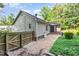 Charming home exterior with screened porch, wooden fence, and lush green yard at 281 Kinsman Ct, Fuquay Varina, NC 27526