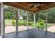 Screened porch with ceiling fan offering views of the manicured lawn and landscaping at 281 Kinsman Ct, Fuquay Varina, NC 27526