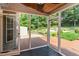 Screened-in porch boasts an inviting backyard view with a patio and lush green lawn at 281 Kinsman Ct, Fuquay Varina, NC 27526