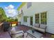 Outdoor back deck with plush seating and a barbecue grill overlooking the backyard at 2933 Creek Moss Ave, Wake Forest, NC 27587