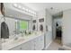 The bathroom features a double sink vanity, a large mirror, and tile floors at 2933 Creek Moss Ave, Wake Forest, NC 27587