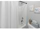 A bathroom features a white shower curtain and marine decor at 2933 Creek Moss Ave, Wake Forest, NC 27587