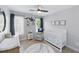 Charming Bedroom featuring a crib, changing table, comfortable chair and nautical decor at 2933 Creek Moss Ave, Wake Forest, NC 27587