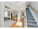 Bright foyer with hardwood floors, staircase, and views into adjacent rooms, creating an inviting entrance at 2933 Creek Moss Ave, Wake Forest, NC 27587