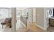 Upstairs hallway with view of foyer, a futon, and several bedrooms at 2933 Creek Moss Ave, Wake Forest, NC 27587