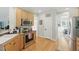 Functional kitchen with stainless steel oven, microwave, light wood cabinets, and hardwood flooring at 2933 Creek Moss Ave, Wake Forest, NC 27587