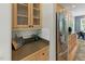 Galley kitchen with stainless steel appliances, custom wood cabinets, and sleek countertops at 2933 Creek Moss Ave, Wake Forest, NC 27587