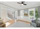 Sunlit room with a picturesque window, hardwood floors, and elegant white trim at 2933 Creek Moss Ave, Wake Forest, NC 27587