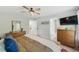This main bedroom features hardwood floors, a ceiling fan, and neutral walls at 2933 Creek Moss Ave, Wake Forest, NC 27587