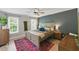 Serene main bedroom with a large bed, accent wall, and ample natural light at 2933 Creek Moss Ave, Wake Forest, NC 27587