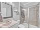 Modern bathroom with a glass-enclosed shower and sleek fixtures at 2969 Thirlestane Dr, Apex, NC 27502