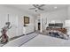 Bedroom featuring a ceiling fan, a desk, and a large window with natural light at 2969 Thirlestane Dr, Apex, NC 27502