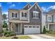 Charming two-story home with a well-manicured front yard and attached two-car garage at 2969 Thirlestane Dr, Apex, NC 27502